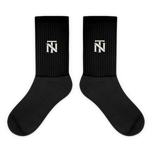 Black NERVE & Thread Signature line crew socks with the ivory Woven NT monogram printed at the calf.