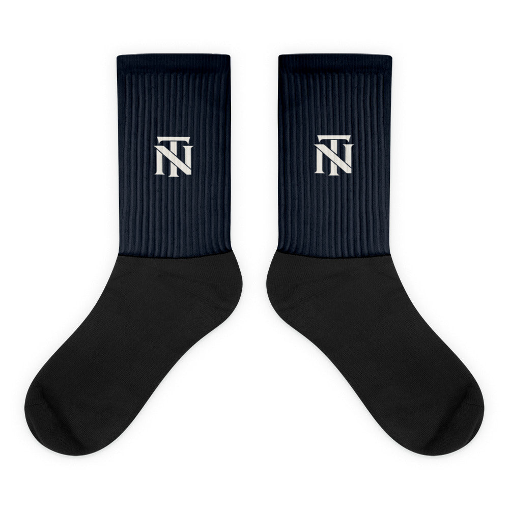 Navy NERVE & Thread Signature line crew socks with the ivory Woven NT monogram printed at the calf.