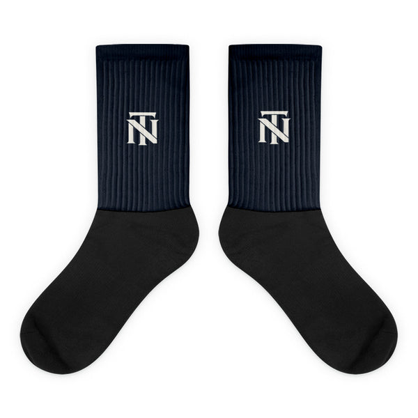 Navy NERVE & Thread Signature line crew socks with the ivory Woven NT monogram printed at the calf.