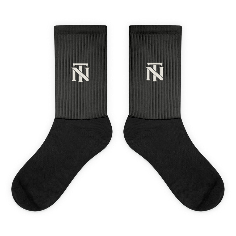 Charcoal NERVE & Thread Signature line crew socks with the ivory Woven NT monogram printed at the calf.