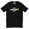 Black short-sleeve tee with cream “Am I canceled yet?” lettering on the chest.
