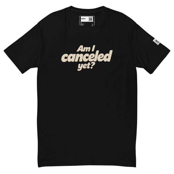 Black short-sleeve tee with cream “Am I canceled yet?” lettering on the chest.