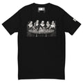 Black short-sleeve tee with a black-and-white illustration of five nuns holding cards around a table with round pieces on it.