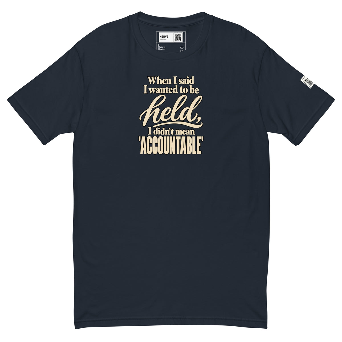 Midnight Navy Held / Accountable graphic tee, front view with cream typography, inside label and left-sleeve QR code.
