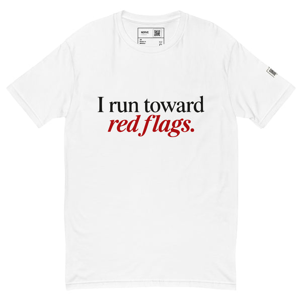 White short-sleeve tee with “I run toward red flags.” lettering, with “red flags.” printed in red.