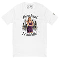 White short-sleeve tee with “I’m so bored I could die!” lettering and a woman in a purple dress against a city skyline.