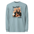 Agave long-sleeve tee with “You fold it in.” lettering and a woman in glasses holding a card.