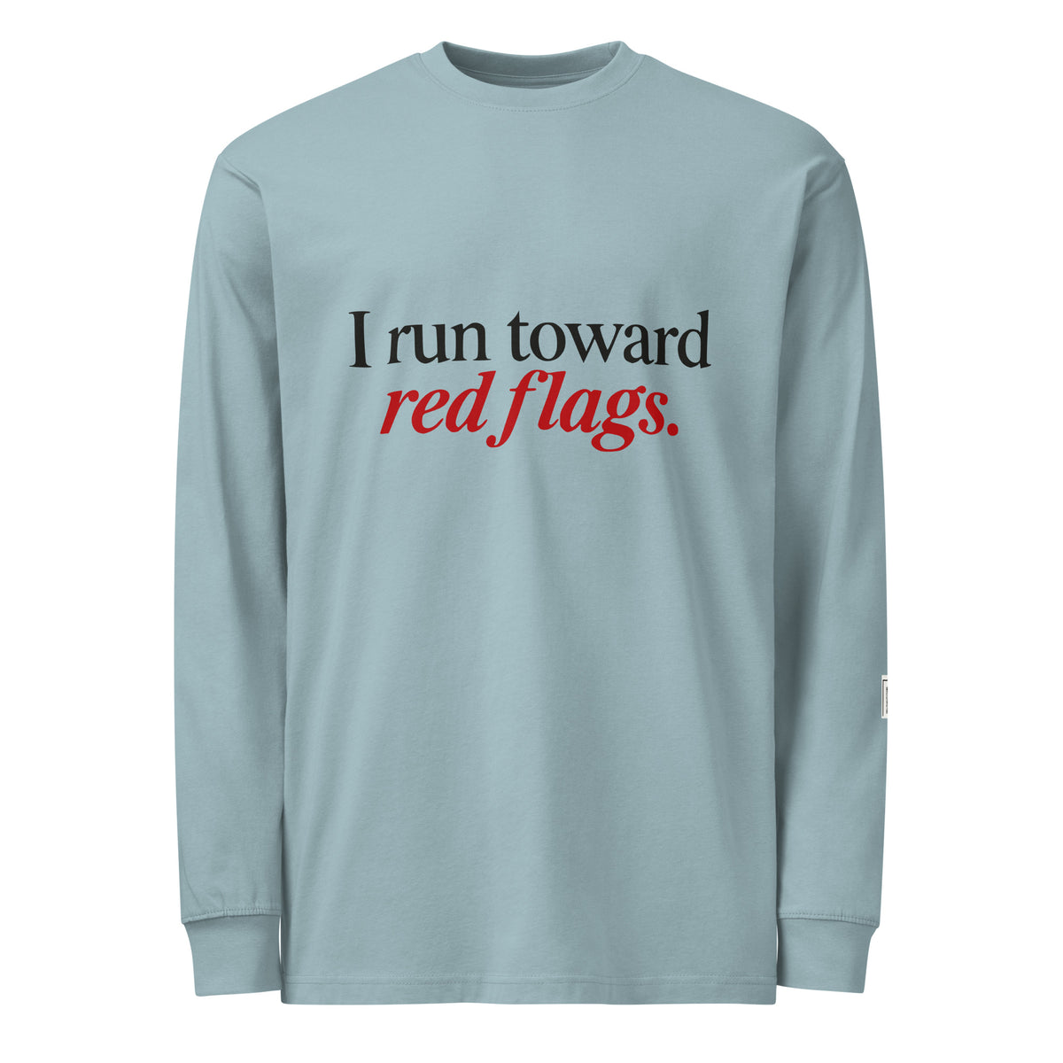 Agave long-sleeve tee with “I run toward red flags.” lettering; “red flags” is printed in red.