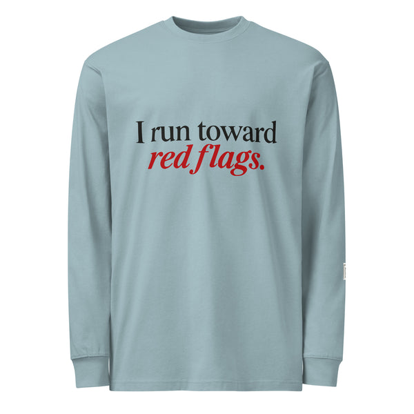 Agave long-sleeve tee with “I run toward red flags.” lettering; “red flags” is printed in red.