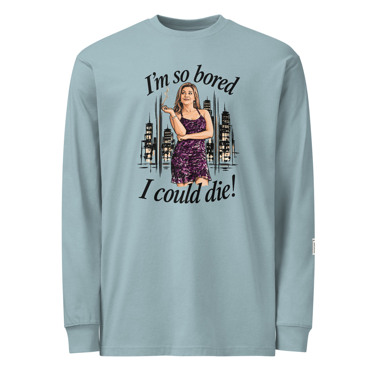 Agave long-sleeve tee with “I’m so bored I could die!” lettering and a woman in a purple dress holding a cigarette against a city skyline.