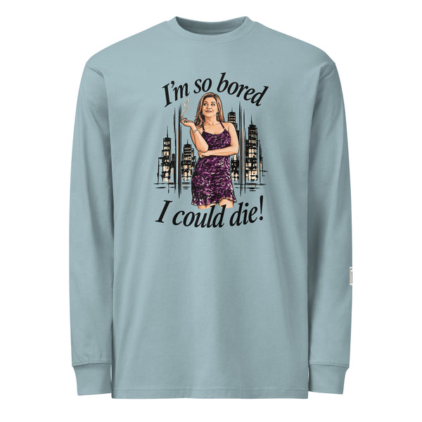 Agave long-sleeve tee with “I’m so bored I could die!” lettering and a woman in a purple dress holding a cigarette against a city skyline.