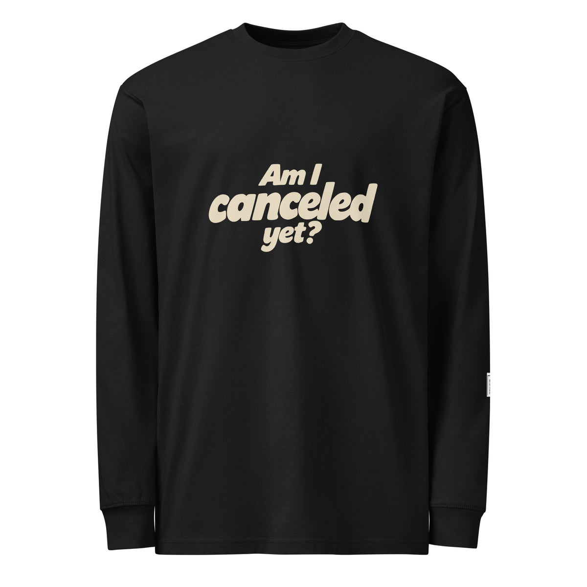 Black long-sleeve tee with stacked cream “Am I canceled yet?” lettering on the front.
