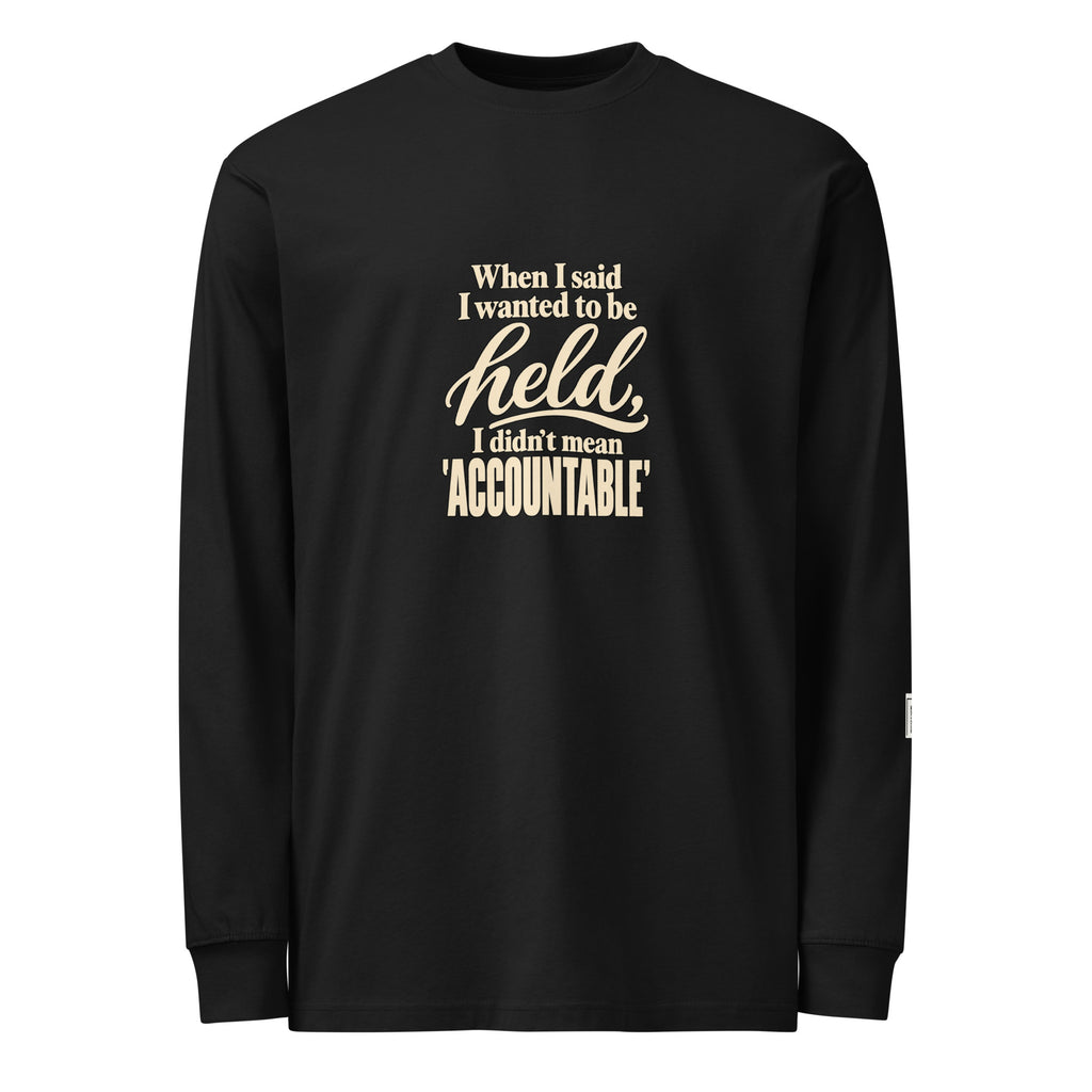 Black long-sleeve tee with “When I said I wanted to be held, I didn’t mean accountable” lettering on the front.