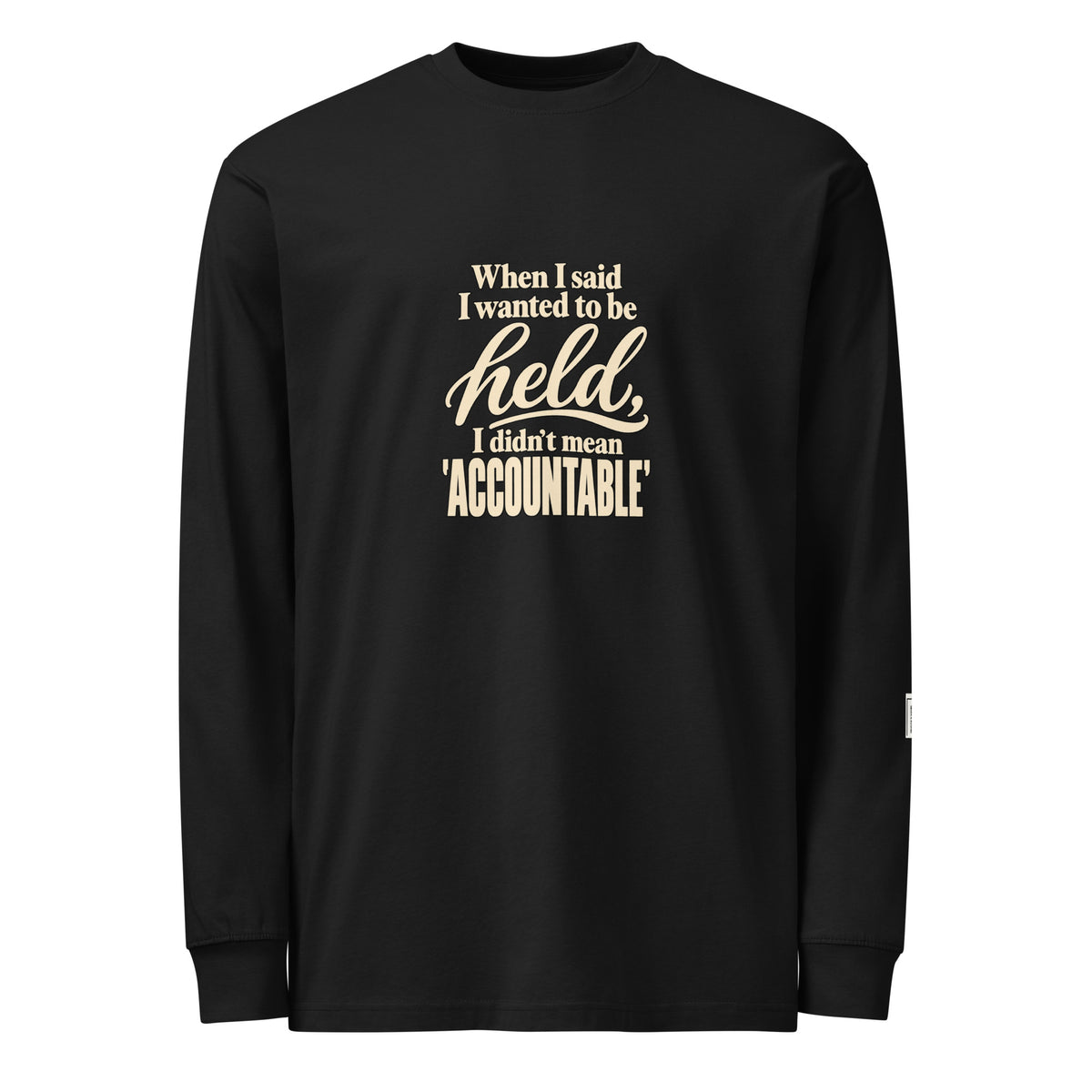 Black long-sleeve tee with “When I said I wanted to be held, I didn’t mean accountable” lettering on the front.