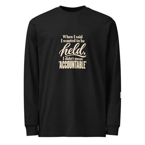 Black long-sleeve tee with “When I said I wanted to be held, I didn’t mean accountable” lettering on the front.