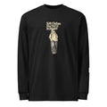 Black long-sleeve tee with “Kelly Clarkson Has Put Us In Danger!” lettering above a standing person in a cap.