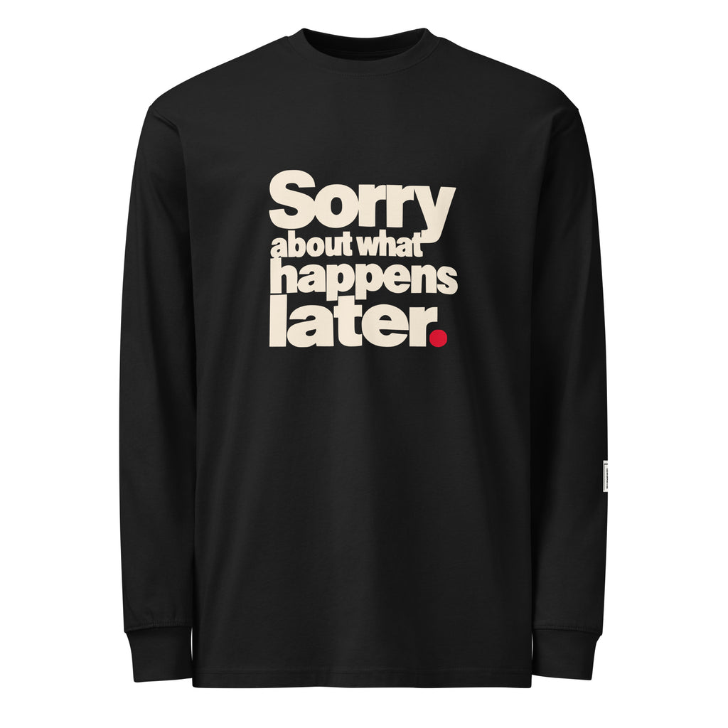 Black long-sleeve tee with stacked cream “Sorry about what happens later.” lettering and a red period.