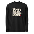 Black long-sleeve tee with stacked cream “Sorry about what happens later.” lettering and a red period.