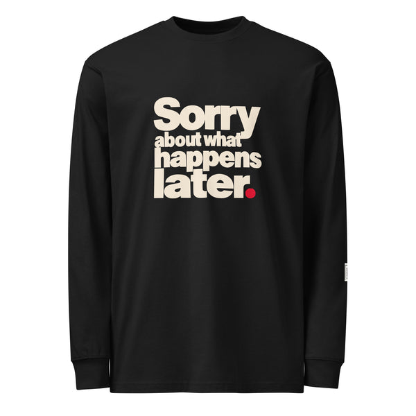 Black long-sleeve tee with stacked cream “Sorry about what happens later.” lettering and a red period.