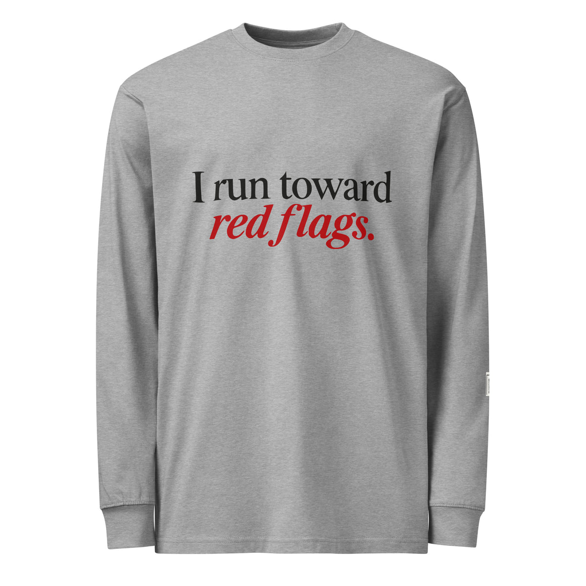 Carbon Grey long-sleeve tee with “I run toward red flags.” lettering; “red flags” is printed in red.