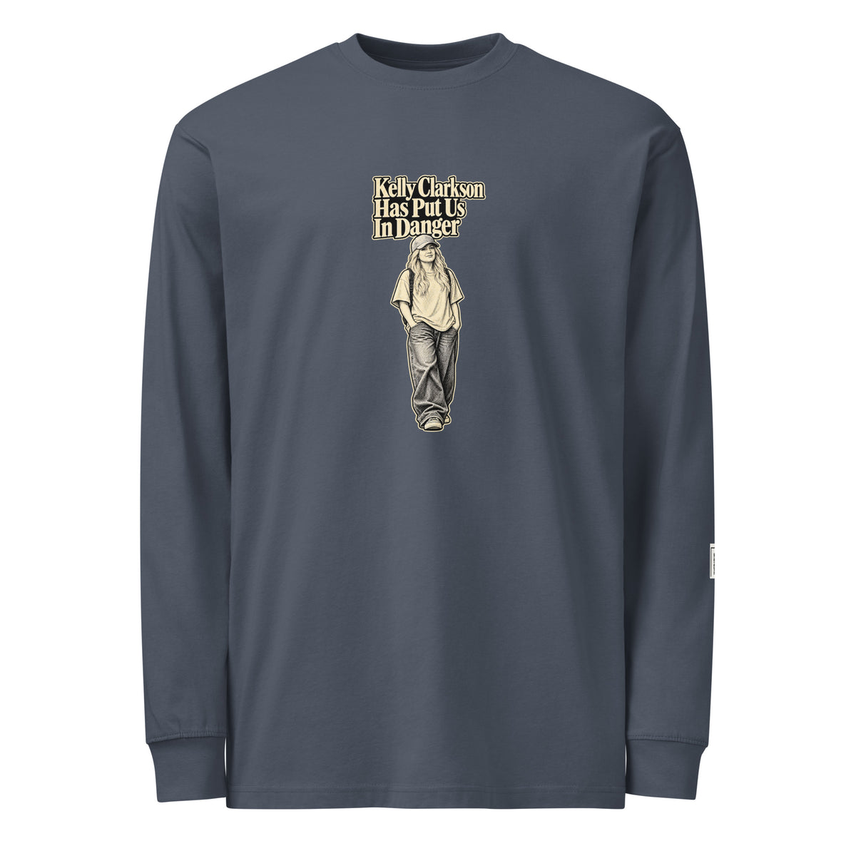 Harbor Blue long-sleeve tee with “Kelly Clarkson Has Put Us In Danger!” lettering above a standing person in a cap.