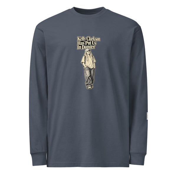 Harbor Blue long-sleeve tee with “Kelly Clarkson Has Put Us In Danger!” lettering above a standing person in a cap.